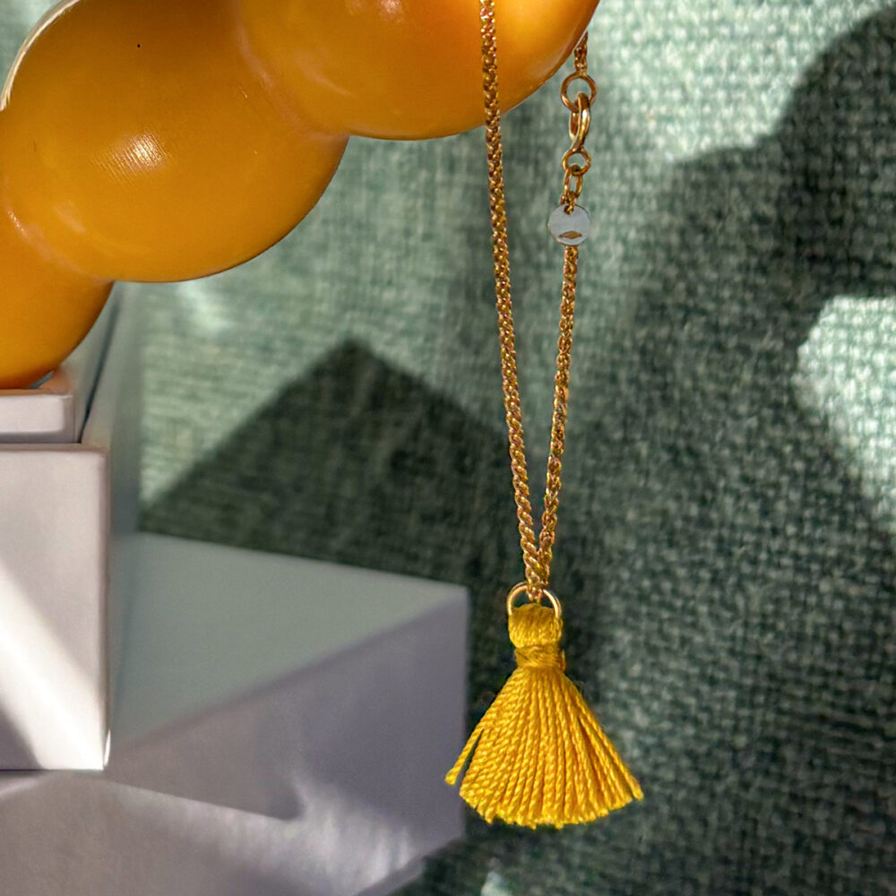 CHARM_NAPPINA_SETA_GIALLA.jpg bracciale catena treccia - oro giallo
